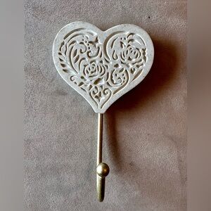 Heart Wall Ornamental Hook Hanger. Cream colored with carving and goldtone hook.